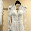 High-Neck Sheer Long-Sleeve Bridal Gown with 3D Embroidery