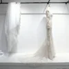 High-Neck Sheer Long-Sleeve Bridal Gown with 3D Embroidery