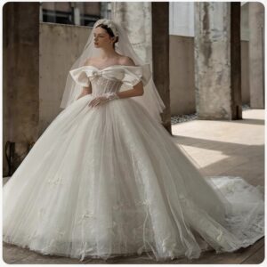 Vintage Off-the-Shoulder Tulle Ball Gown Wedding Dress with Oversized Bow & Dramatic Long Train, Romantic Bridal Gown
