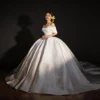 Classic Off-the-Shoulder Satin Wedding Dress with Voluminous Skirt & Lace Details