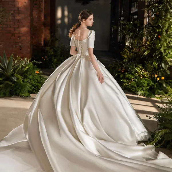 Timeless Satin Ball Gown Wedding Dress with Short Sleeves & Bow Accent