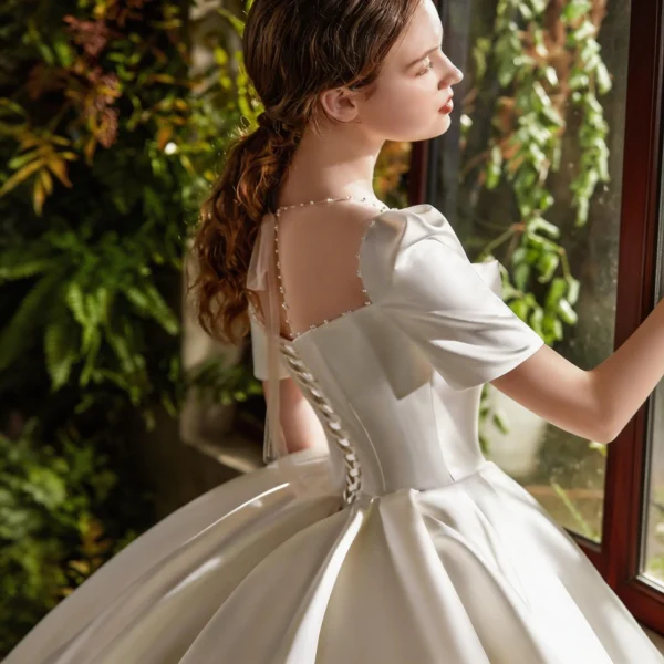 Timeless Satin Ball Gown Wedding Dress with Short Sleeves & Bow Accent