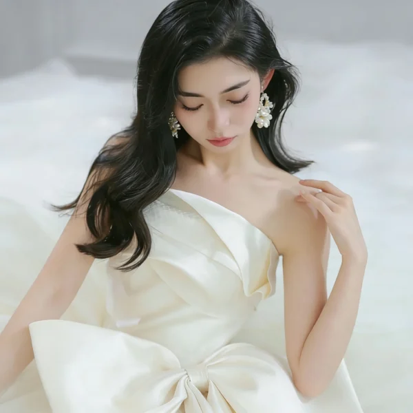 Modern Strapless Ball Gown Wedding Dress with Oversized Bow Accent