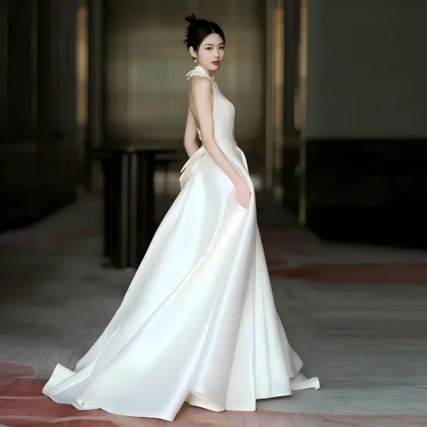 Sleek Halter Neck Satin Wedding Dress with Open Back & Pockets