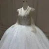 Opulent Long Sleeve Wedding Dress with Shimmering Tulle