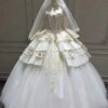 Whimsical Tiered Tulle Bridal Gown with Floral Accents