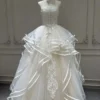 Tiered Wave Bridal Gown with Delicate Bow Ribbon and Vertical Lace Applique
