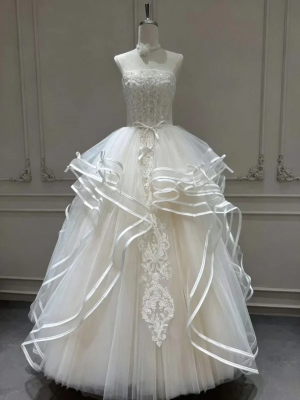 Tiered Wave Bridal Gown with Delicate Bow Ribbon and Vertical Lace Applique