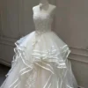 Tiered Wave Bridal Gown with Delicate Bow Ribbon and Vertical Lace Applique