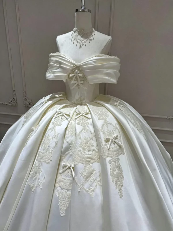 Off-the-Shoulder Heavy Satin Ball Gown featuring Embroidered Lace and Bow Details