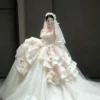 Whimsical Tiered Tulle Bridal Gown with Floral Accents