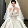 Ivory Strapless Draped Satin Ball Gown